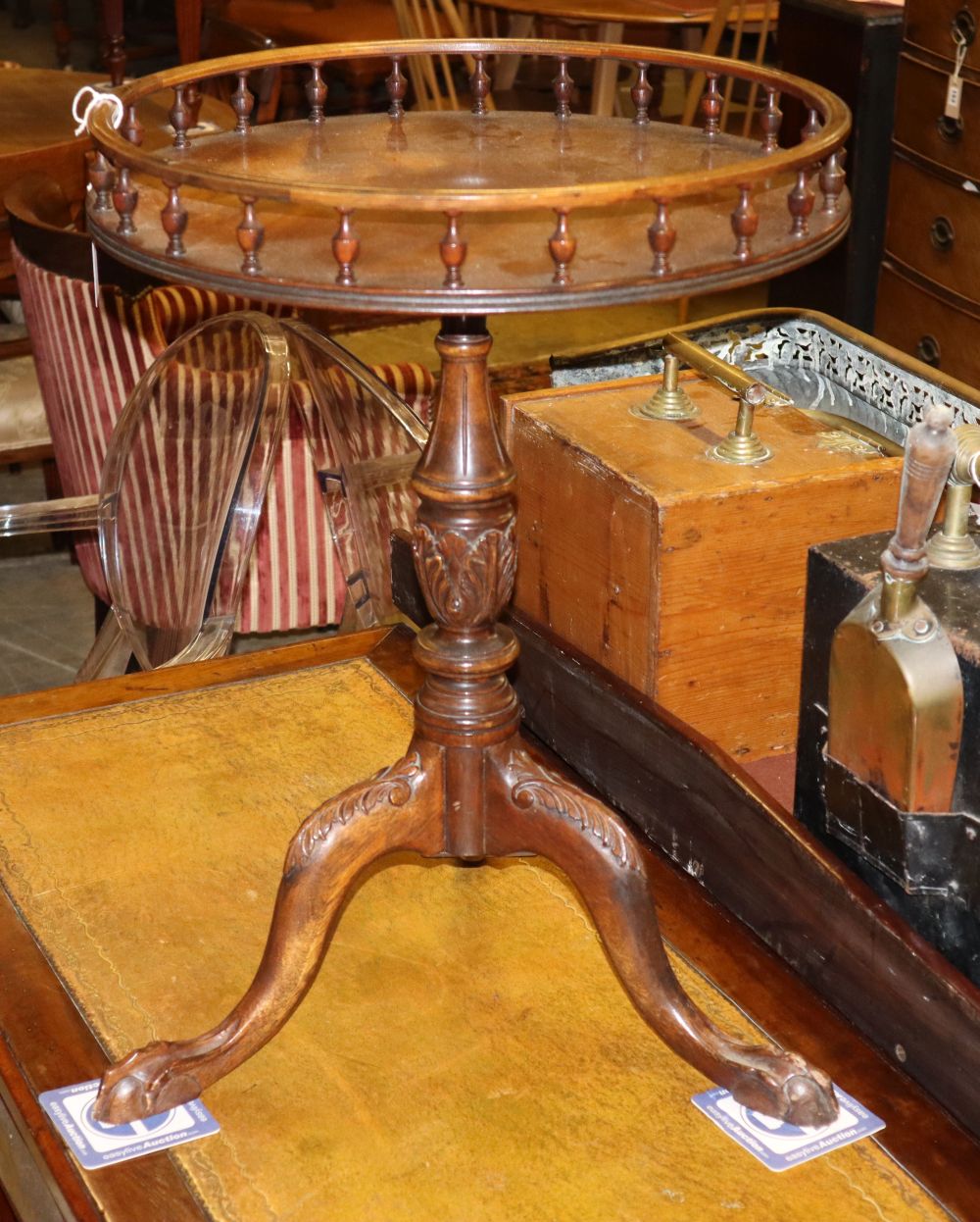 A George III style mahogany circular galleried tripod table, 48cm diameter, H.64cm